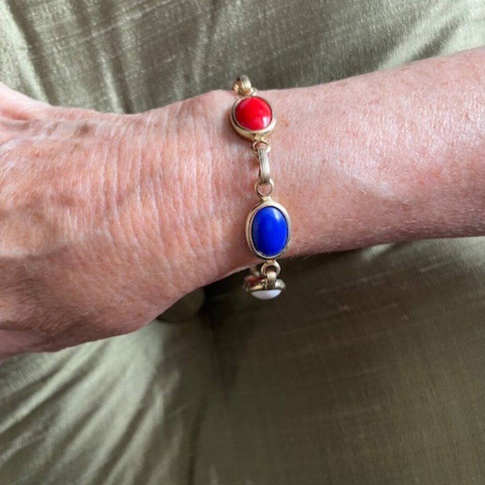 Gold tone bracelet-  Red, white & blue cobochon stones